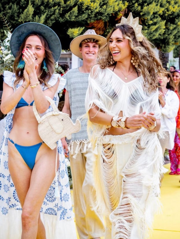 Women dressed in bohemian outfits laughing and celebrating at an Ibiza summer event—colorful festival content by vIBZ Marketing.
