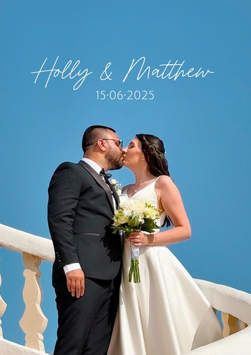 Cala Tarida wedding couple kiss – romantic Ibiza beach wedding photography.