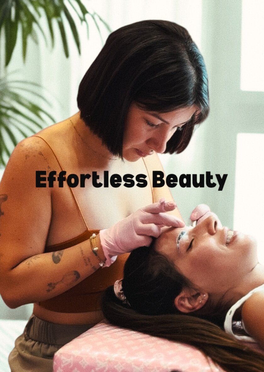 “Beauty artist working on eyebrows of a smiling client—effortless beauty and tattoo-inspired content creation in Ibiza by vIBZ Marketing.